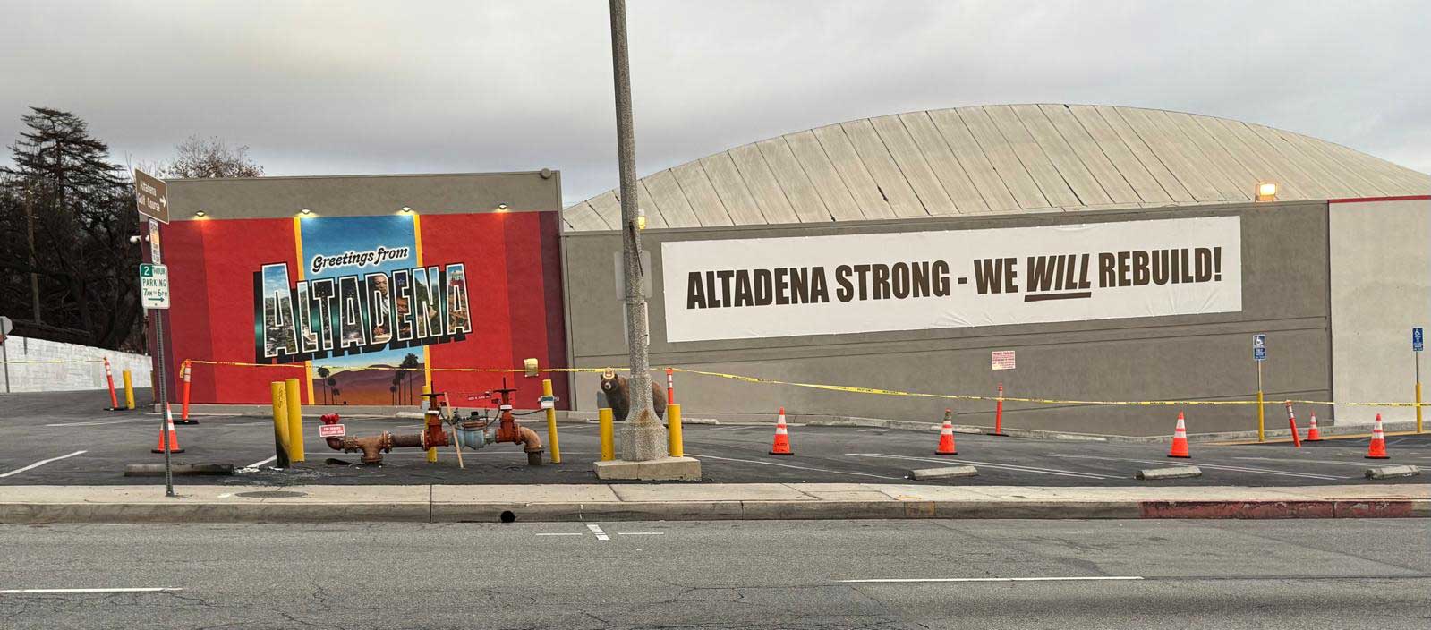 Firefighters and emergency vehicles respond to the Eaton Fire in Altadena, surrounded by heavy smoke and low visibility.